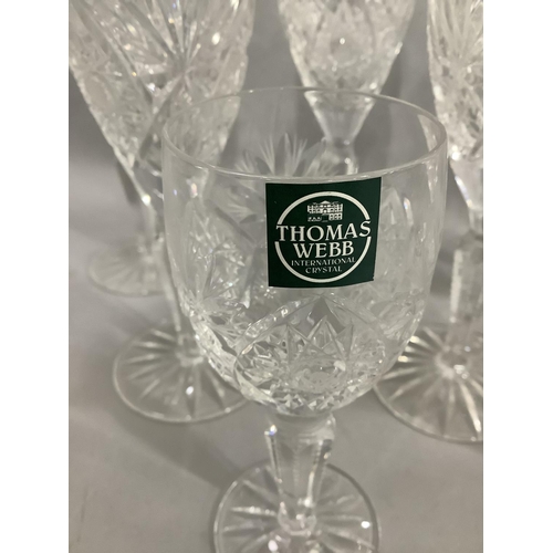 39 - A set of seven Thomas Webb crystal wine glasses and two port glasses, cut bowls and panel stems, on ... 