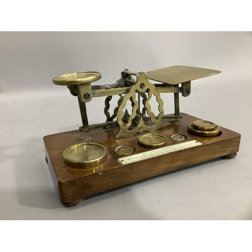 40 - A Victorian set of mahogany and brass postal scales by Samuel Morden and Co with weights and ivory p... 