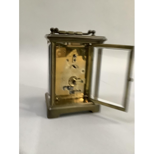 71 - Brass carriage clock with French movement and Roman numeral dial, 14.5cm high