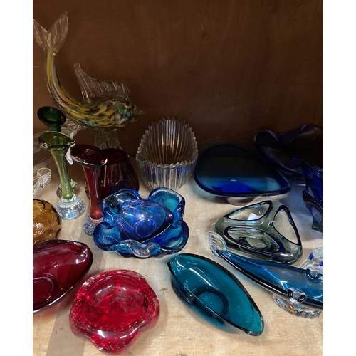 92 - A quantity of art glass to include sculpture of a dolphin with coloured inclusions, blue glass star ... 