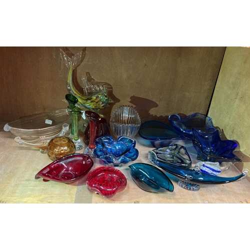 92 - A quantity of art glass to include sculpture of a dolphin with coloured inclusions, blue glass star ... 