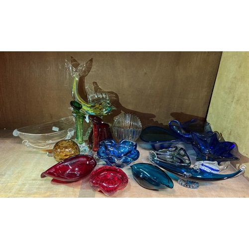 92 - A quantity of art glass to include sculpture of a dolphin with coloured inclusions, blue glass star ... 