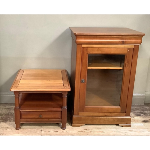 137 - An audio cabinet and matching lamp table with double sided drawers