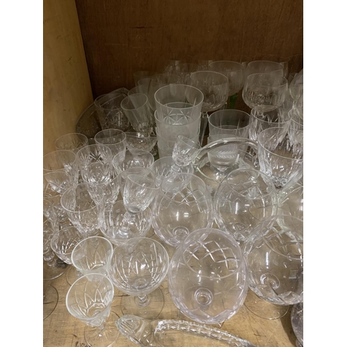 102 - A quantity of mixed glassware including hocks, brandies, wines, cruet  together with various meat pl... 