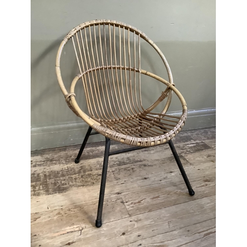 116 - A cane 1970s chair on metal framing, cane bucket seat