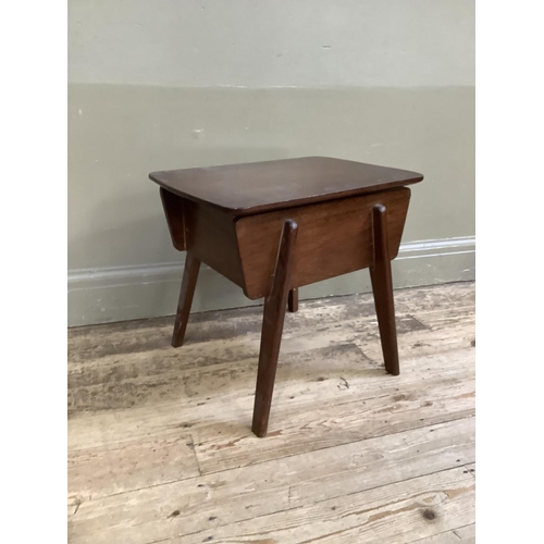 141 - A 1950's teak sewing table with contents, 48cm wide, 47cm high, 38cm deep