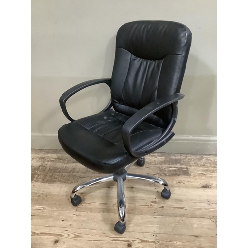 155 - A black vinyl swivel office chair on five legs with adjustable seat and arm rest