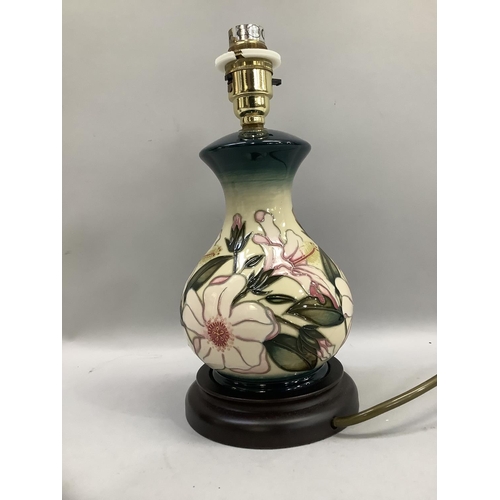 51 - A Moorcroft table lamp of baluster outline, tube lined and glazed in ivory, pale yellow, pink and gr... 