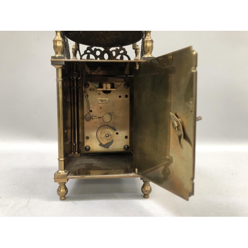 56 - A reproduction brass skeleton clock by Buren, Swiss made, serial number 120989, 25.5cm high