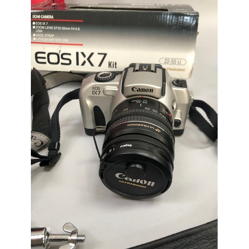 216 - Canon EOS IX7 camera, in original box with leather case, Pentax UCF mini binoculars together with ph... 