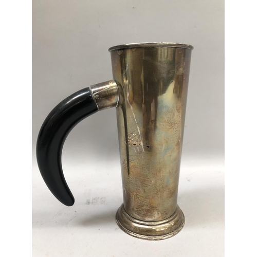 365 - A mid 20th century tankard with buffalo horn handle, tapered straight sides over a stepped circular ... 