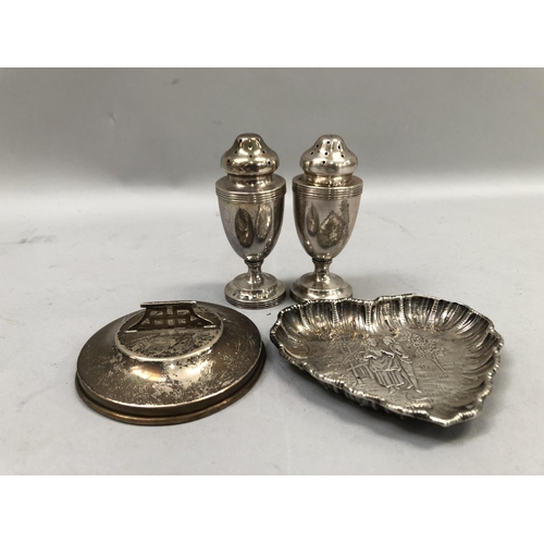 368 - A late 19th century heart shaped silver dish chased with a rustic courting couple within a rural lan... 