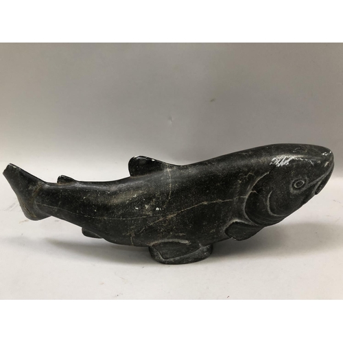 54 - An Inuit stone carving of a salmon signed to the underside Johnassie.S, damage and repair to the tai... 