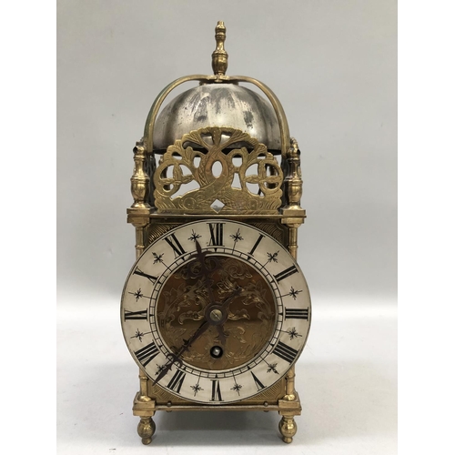 56 - A reproduction brass skeleton clock by Buren, Swiss made, serial number 120989, 25.5cm high