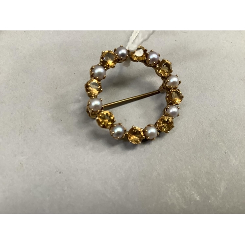 408 - A citrine and pearl wreath brooch, the circular faceted stones and 3mm half pearls claw set in alter... 