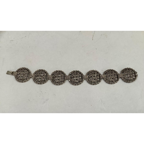 410 - A marcasite set silver bracelet each roundel link with pierced stars, approximate length 17.5cm, app... 