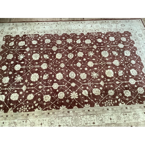 535 - A large Zeigler style burgundy and cream floral rug with deep cream border