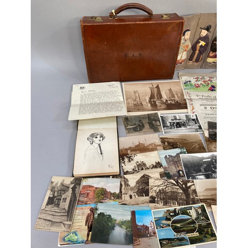 312 - A leather and card suitcase containing postcards of Robin Hood's Bay, Whitby and other East Coast vi... 