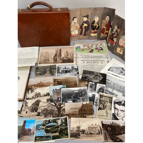 312 - A leather and card suitcase containing postcards of Robin Hood's Bay, Whitby and other East Coast vi... 