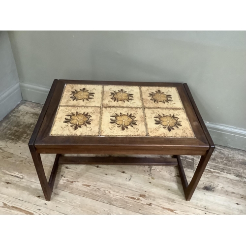 151 - A 1970's teak coffee table with two stretchers, the top inset with tiles, 75cm wide, 50cm deep toget... 