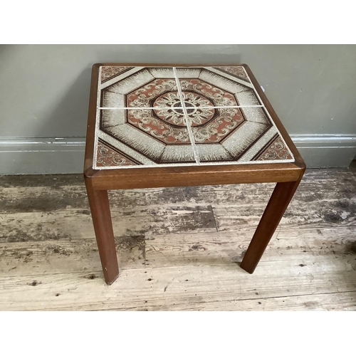 151 - A 1970's teak coffee table with two stretchers, the top inset with tiles, 75cm wide, 50cm deep toget... 