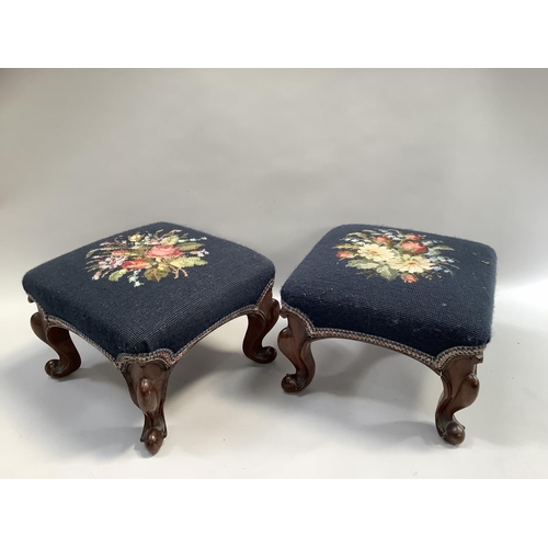 267 - A pair of stools on carved cabriole legs with needlework upholstery