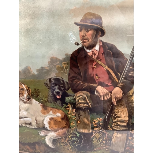 292 - A chromolithograph of a gamekeeper sitting alongside a punt with dead game and retrievers in rosewoo... 