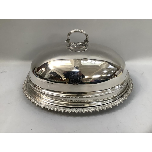 311 - A silver plated meat cover and associated stand, the cover having a reeded loop handle and gadroon r... 