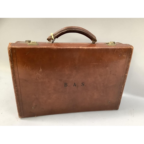 312 - A leather and card suitcase containing postcards of Robin Hood's Bay, Whitby and other East Coast vi... 