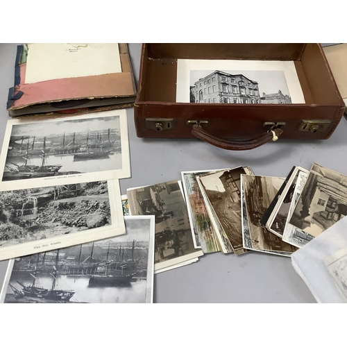 312 - A leather and card suitcase containing postcards of Robin Hood's Bay, Whitby and other East Coast vi... 