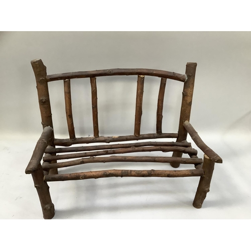 325 - A doll's rustic bench, 50cm wide x 40cm