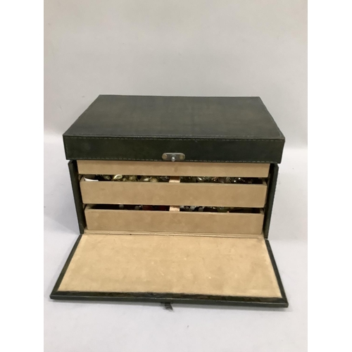 381 - A dark green jewellery box containing a collection of necklaces, earclips and brooches with a velvet... 