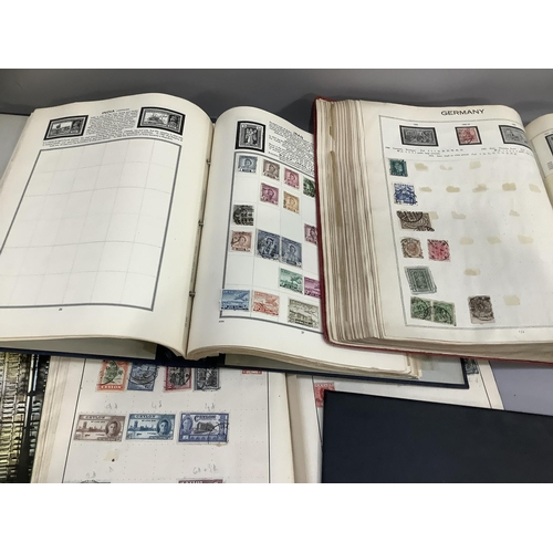 383B - A Challenge postage stamp album containing stamps from around the world, 1930s onwards, together wit... 