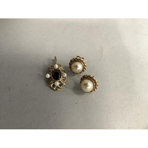 395 - A pair of cultured pearl stud earrings in 9ct gold each set to the centre with a 8.5mm pearl within ... 