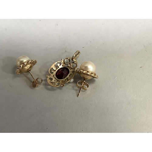 395 - A pair of cultured pearl stud earrings in 9ct gold each set to the centre with a 8.5mm pearl within ... 