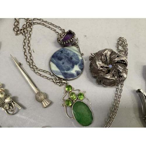 404 - A collection of silver and white metal jewellery (test as silver) including a chrysanthemum bead pen... 