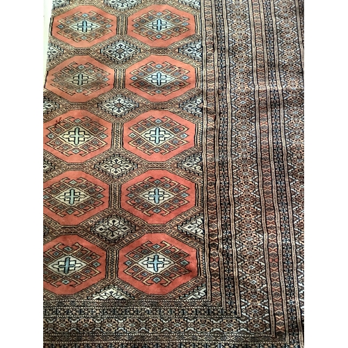 539 - A Middle eastern silk square floor rug with red diamonds within heavy mosaic border, 220cm x 180cm