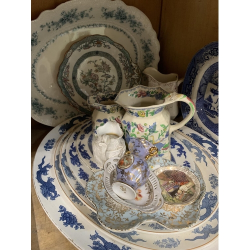 106 - A quantity of 19th century graduated meat plates with trailing dragons, ironstone jug, willow patter... 