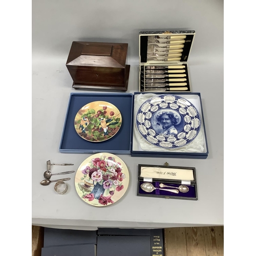 197 - A mahogany tea caddy, a cased set of fish knives and forks, three china plates limited editions, cas... 