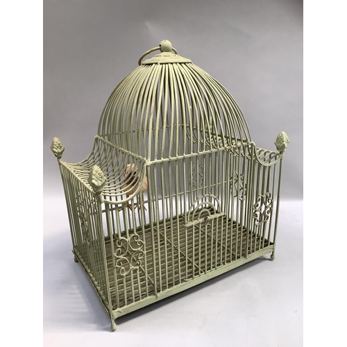 266 - A green wire ornate bird cage with four acorn finials, arched door and ring pull handle , including ... 