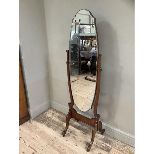 270 - A 1920s/30s cheval mirror with bevelled glass on twin supports