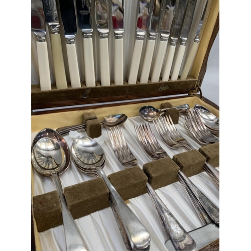 330 - An oak cased canteen of plated cutlery, E McClarence, Sheffield, England