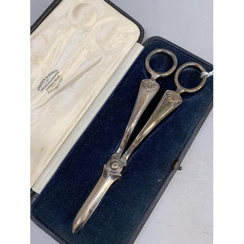 359 - An Edward VII pair of silver grape scissors with scallop handles, hallmarked Sheffield 1902 for Atki... 