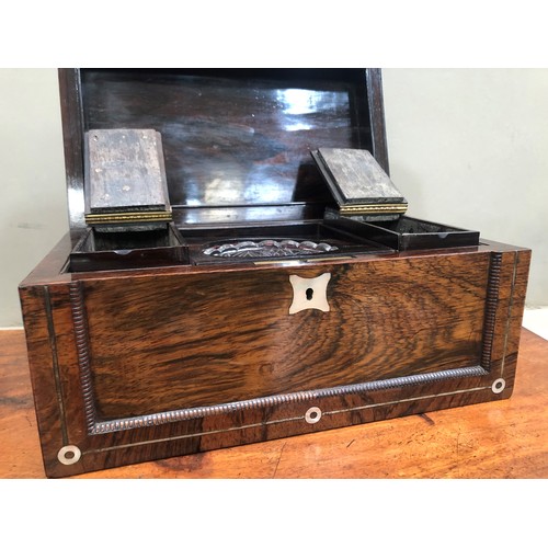 38B - A 19th century rosewood and mother of pearl inlaid tea caddy, the indented panels with quarter beadi... 