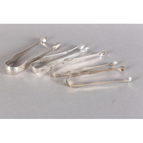 281 - A PAIR OF SCOTTISH SILVER BRIGHT CUT SUGAR TONGS c.1790 together with three other pairs of silver to... 