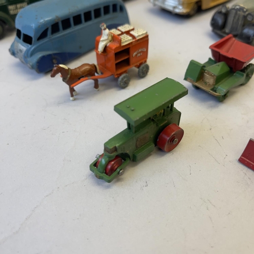 101 - A collection of nine die cast models including a Dinky 27F Estate Car, a Dinky Daimler Ambulance, a ... 