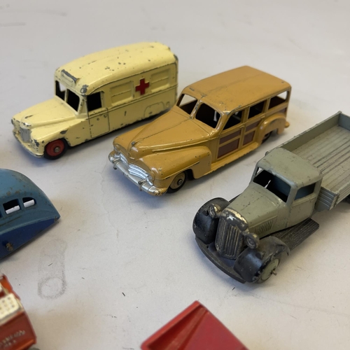 101 - A collection of nine die cast models including a Dinky 27F Estate Car, a Dinky Daimler Ambulance, a ... 