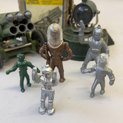 102 - An Astra-Pharos Rocket Gun, an Astra-Pharos Searchlight and five 1950s plastic spacemen.