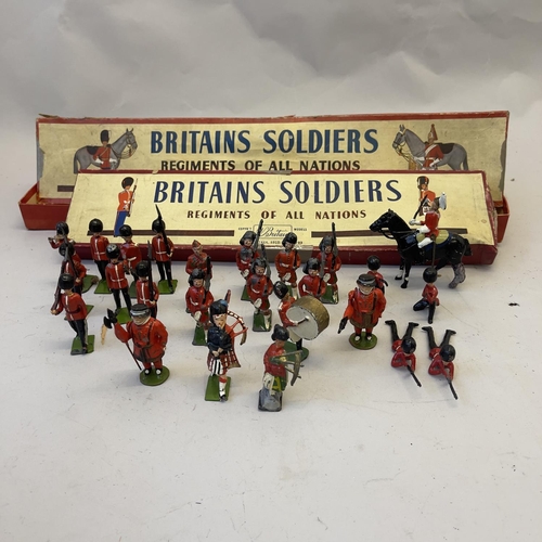 108 - A collection of Britains lead soldiers, including the Grenadiers, the Scots Guards and two beefeater... 