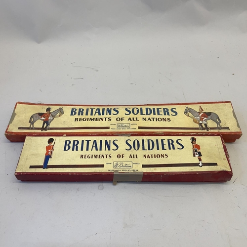 108 - A collection of Britains lead soldiers, including the Grenadiers, the Scots Guards and two beefeater... 